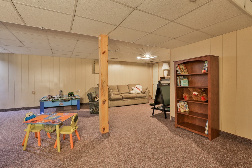 20 Patten Road Tewksbury, MA 01876 - Photo 27 of 29 a hallway with a table and chairs