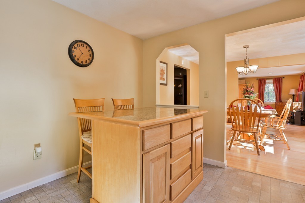 20 Patten Road Tewksbury, MA 01876 - Photo 6 of 29 a view of a kitchen with table and chairs