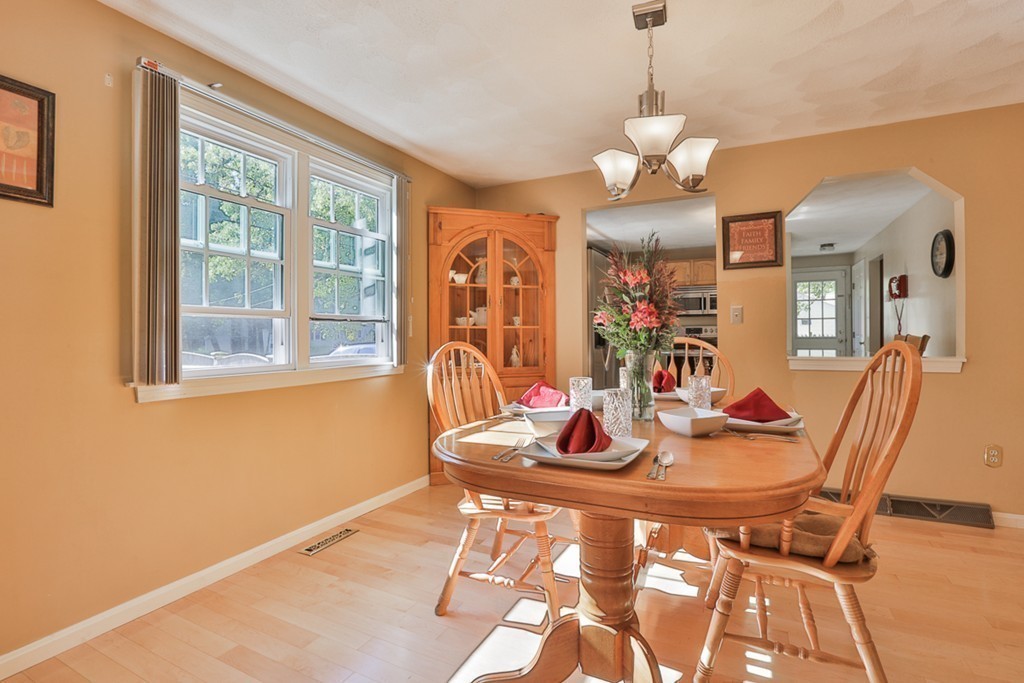 20 Patten Road Tewksbury, MA 01876 - Photo 7 of 29 a view of a dining room with furniture wooden floor and chandelier