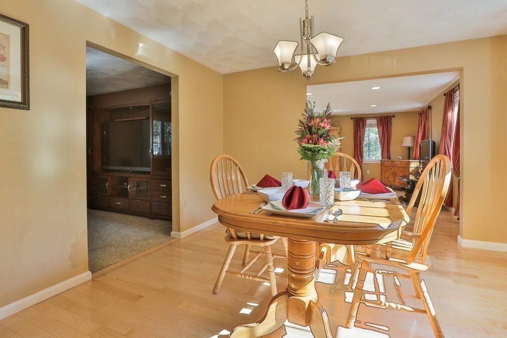 20 Patten Road Tewksbury, MA 01876 - Photo 8 of 29 a view of a dining room with furniture and chandelier
