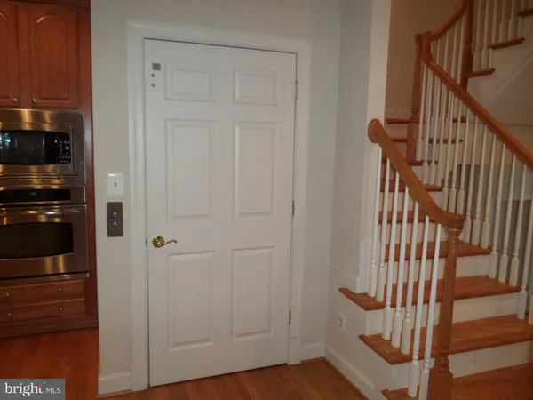 a view of an entryway with wooden floor
