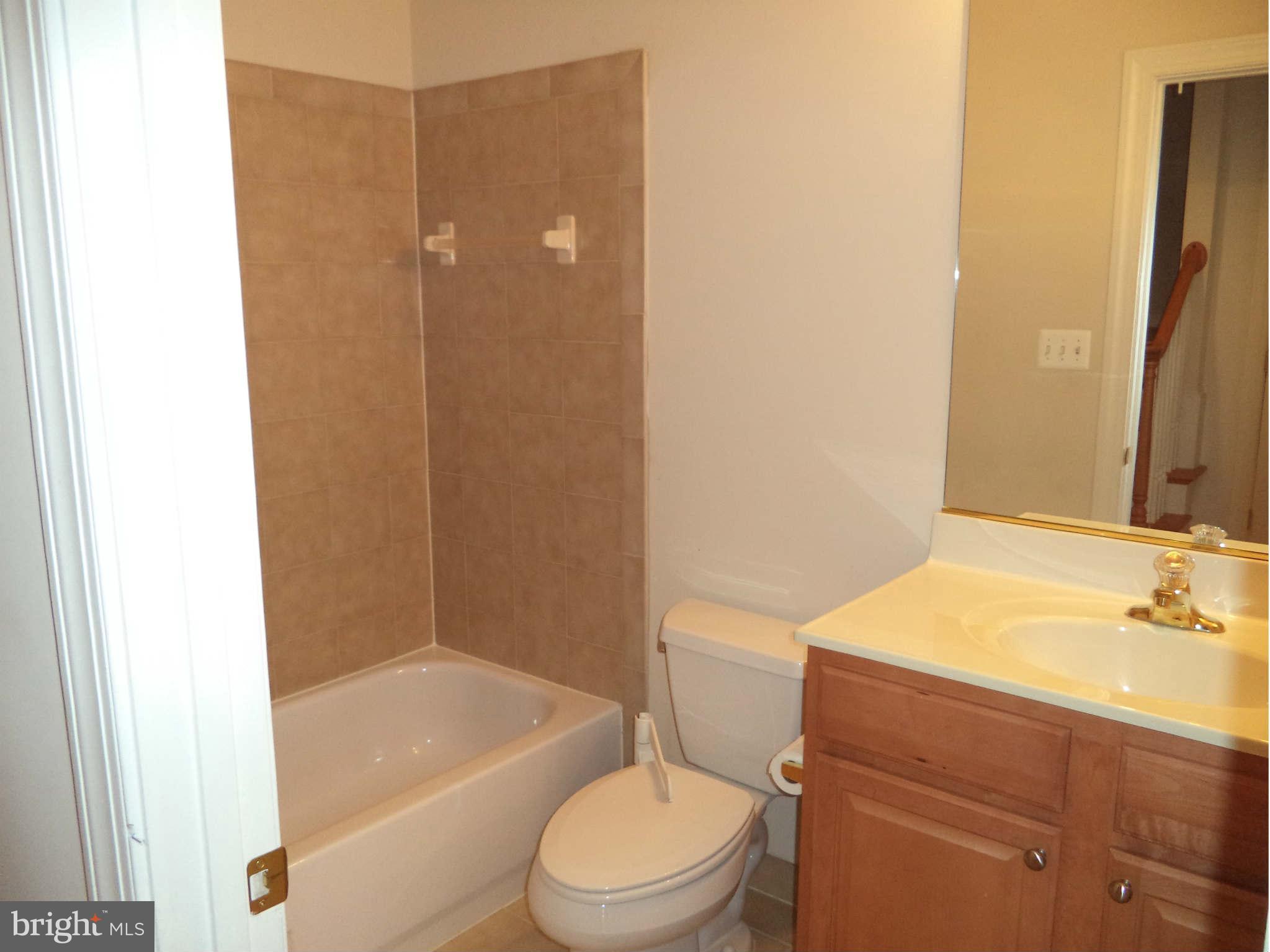 6812 Rigby Lane McLean, VA 22101 - Photo 22 of 23 a bathroom with a sink a toilet and shower