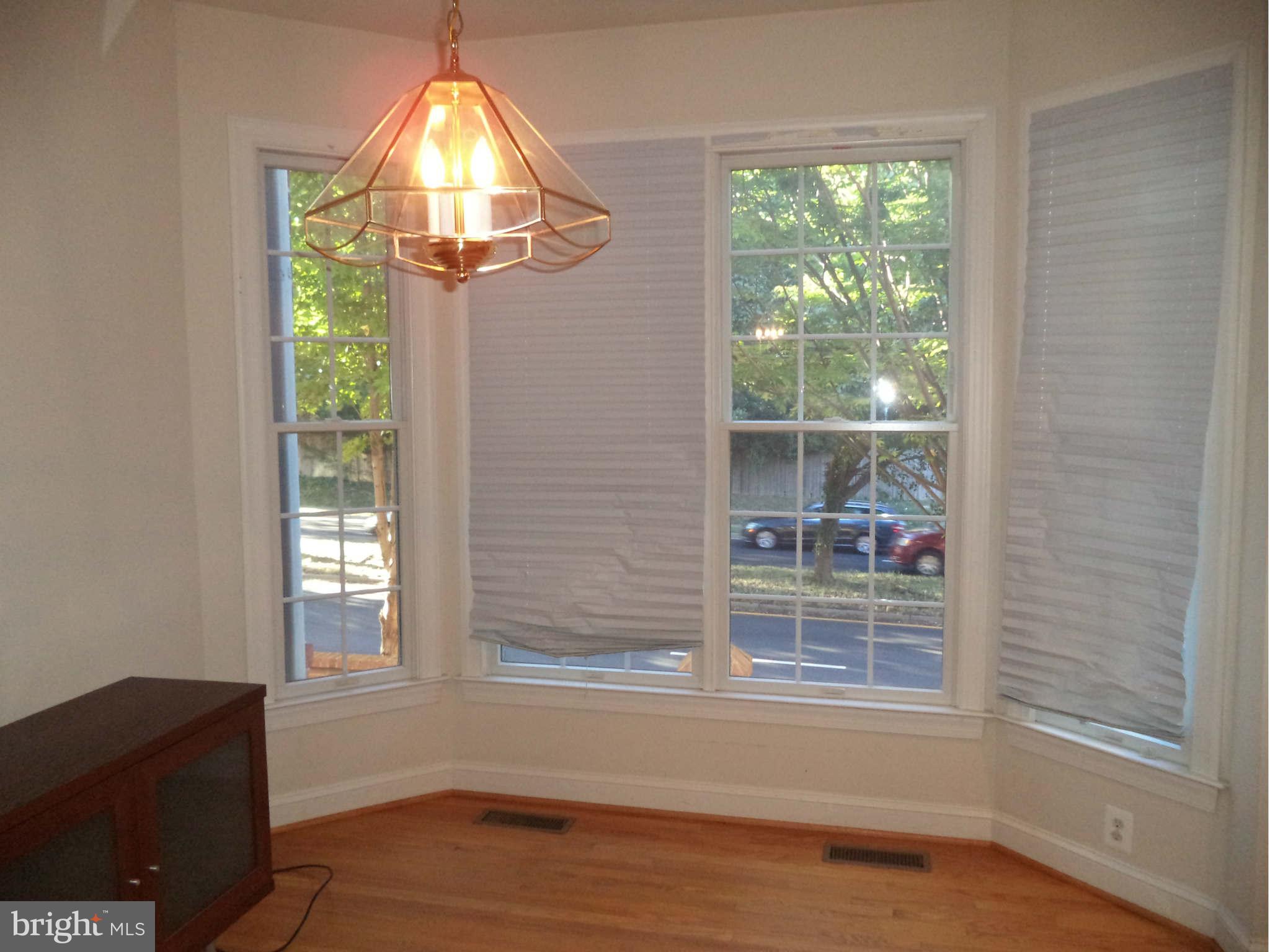 6812 Rigby Lane McLean, VA 22101 - Photo 10 of 23 an empty room with wooden floor and windows
