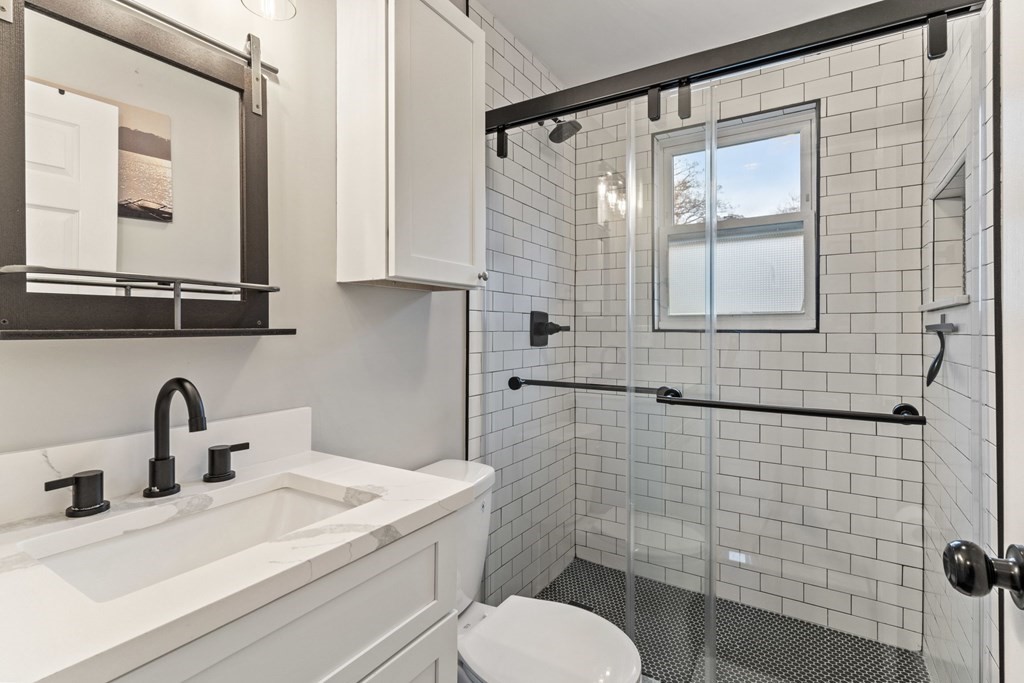 7 Meadowbrook Lane Ashland, MA 01721 - Photo 14 of 18 a bathroom with a toilet a sink and mirror