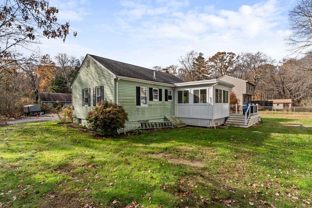 7 Meadowbrook Lane Ashland, MA 01721 - Photo 4 of 18 a view of a house with a yard and sitting area