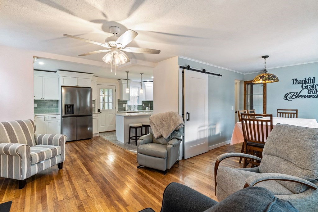 7 Meadowbrook Lane Ashland, MA 01721 - Photo 6 of 18 a living room with furniture and wooden floor