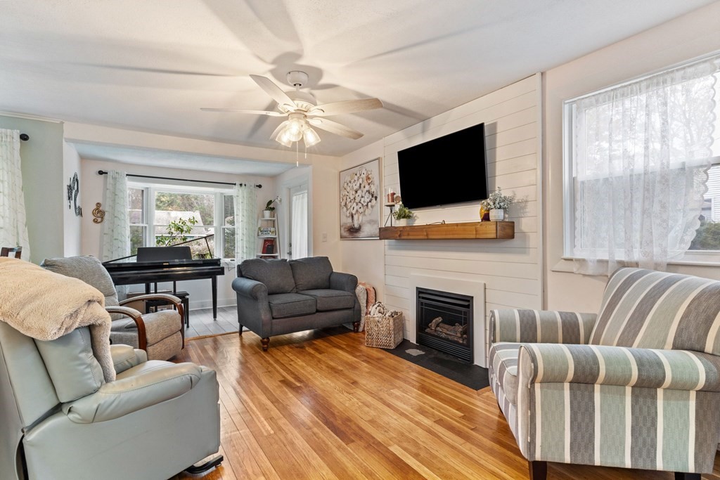 7 Meadowbrook Lane Ashland, MA 01721 - Photo 8 of 18 a living room with furniture fireplace and flat screen tv