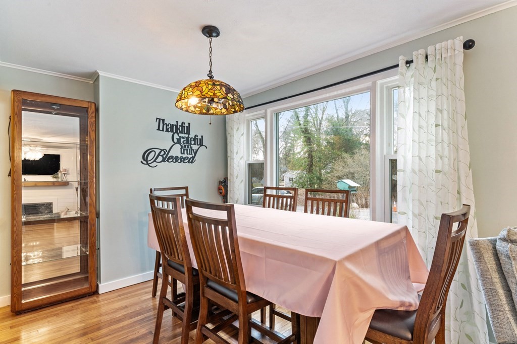 7 Meadowbrook Lane Ashland, MA 01721 - Photo 9 of 18 a view of a dining room with furniture window and wooden floor