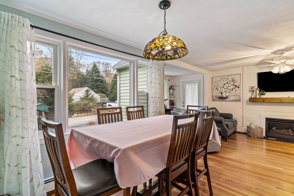 7 Meadowbrook Lane Ashland, MA 01721 - Photo 10 of 18 a view of a dining room with furniture wooden floor and chandelier