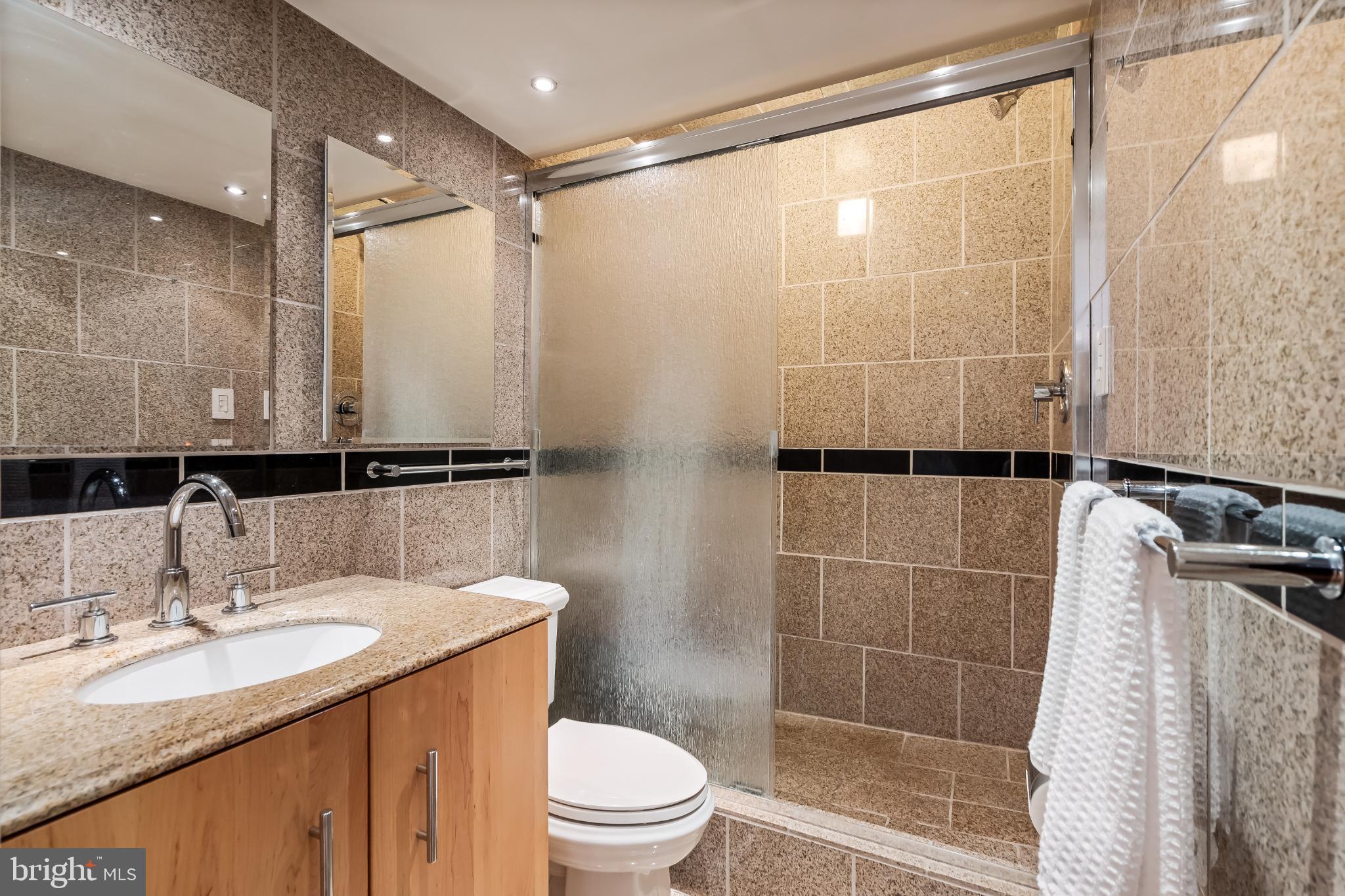 1816 New Hampshire Avenue Northwest, Unit 1009 Washington, DC 20009 - Photo 15 of 23 a bathroom with a sink toilet and shower