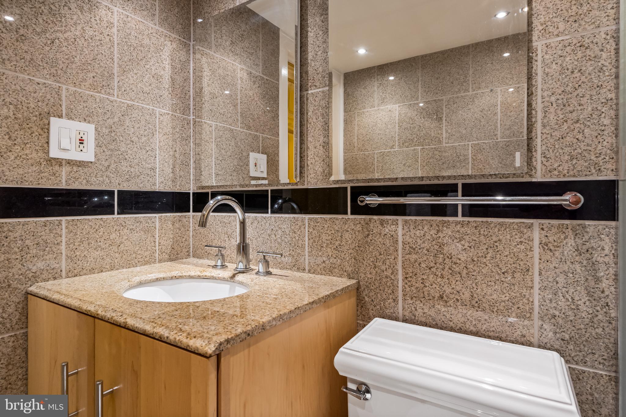 1816 New Hampshire Avenue Northwest, Unit 1009 Washington, DC 20009 - Photo 16 of 23 a bathroom with a sink and a toilet