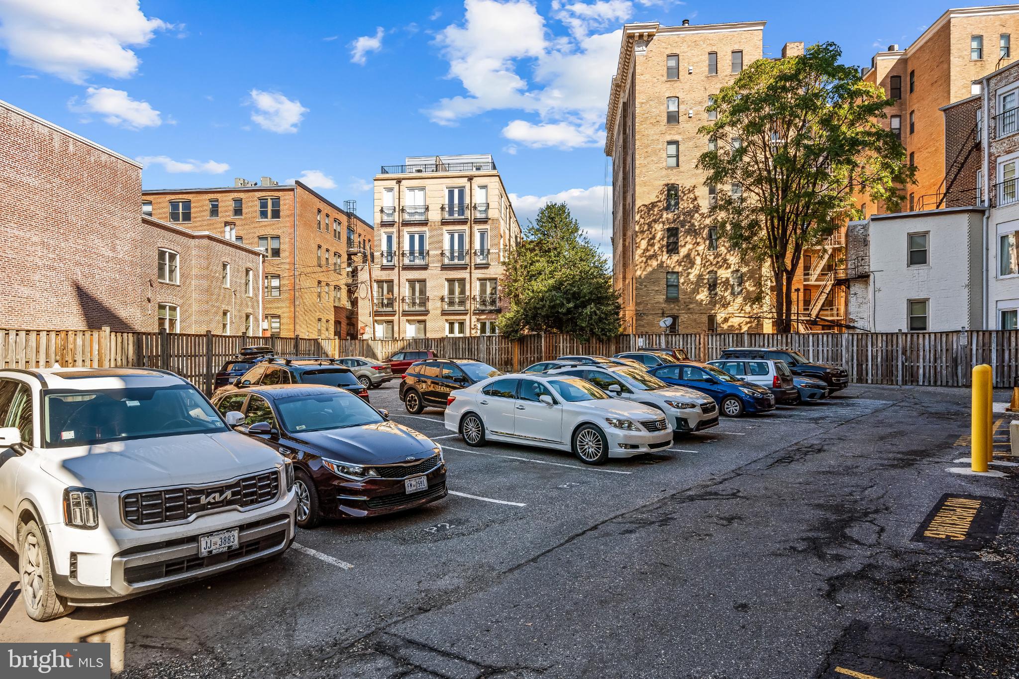 1816 New Hampshire Avenue Northwest, Unit 1009 Washington, DC 20009 - Photo 19 of 23 a view of cars parked in front of a house