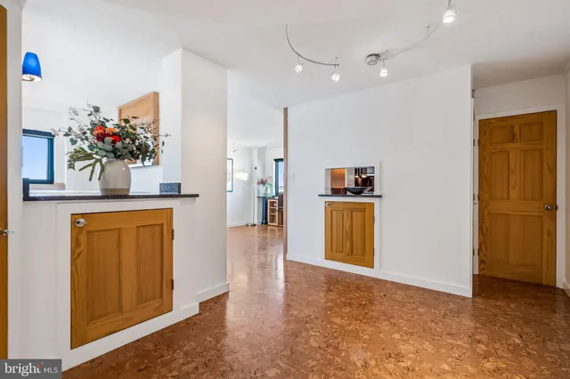 a view of a kitchen cabinets and wooden floor
