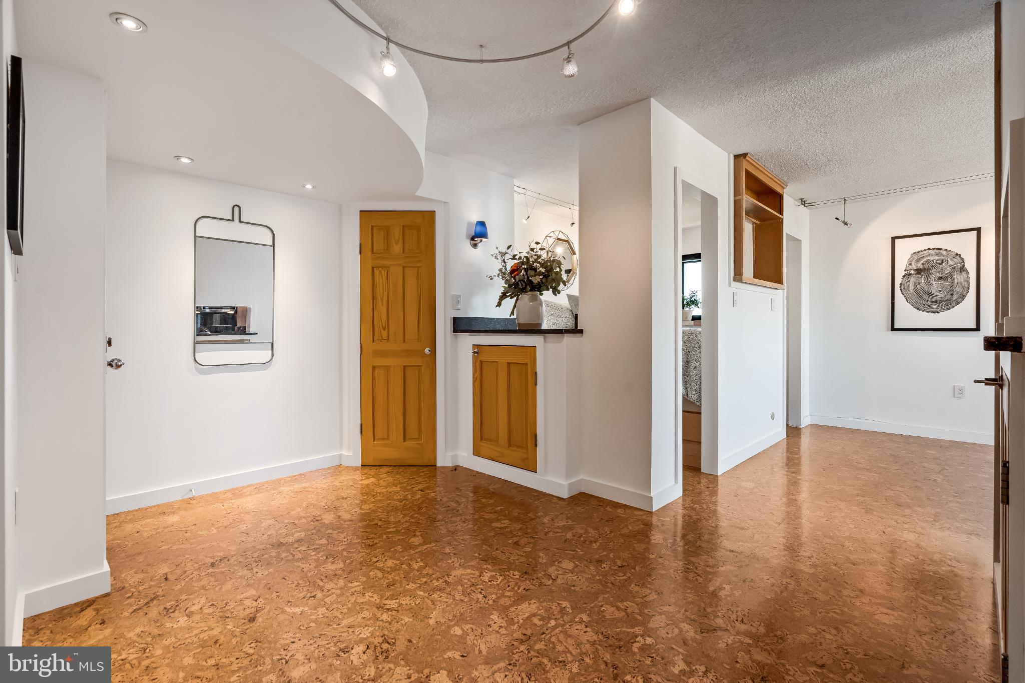 1816 New Hampshire Avenue Northwest, Unit 1009 Washington, DC 20009 - Photo 4 of 23 a view of a big room with wooden floor and windows