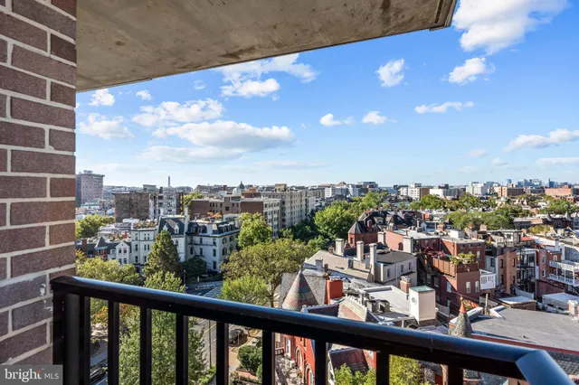 a view of a balcony with city view