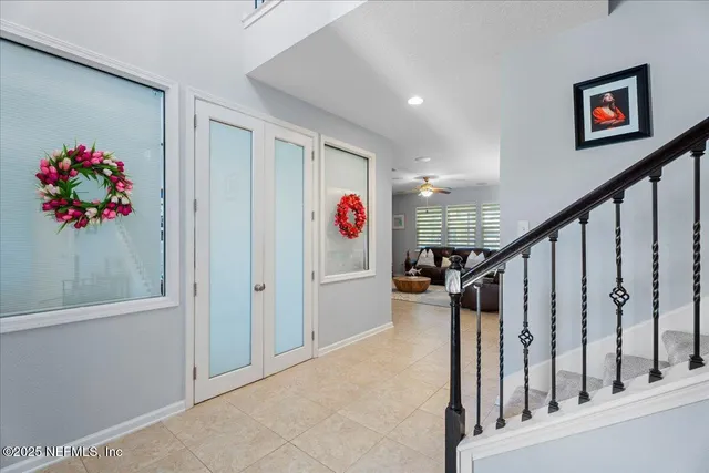 a view of an entryway with wooden floor