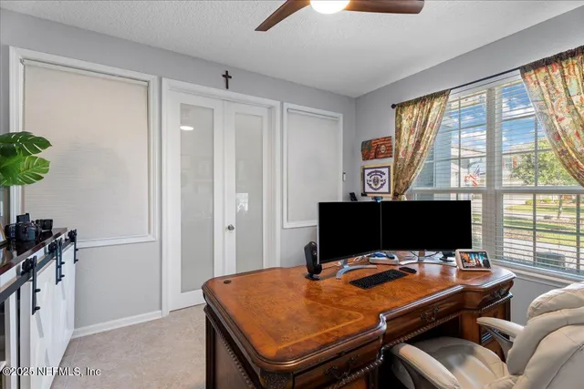 a view of a workspace with furniture