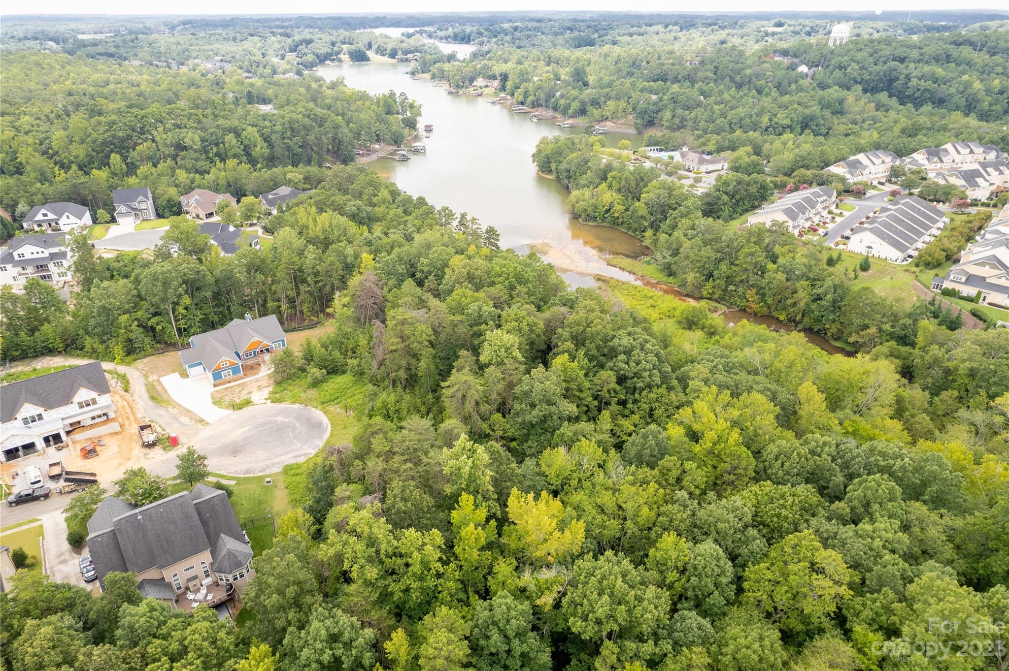 686 Reliance Court Tega Cay, SC 29708 - Photo 10 of 20 an aerial view of a house with a yard and lake view