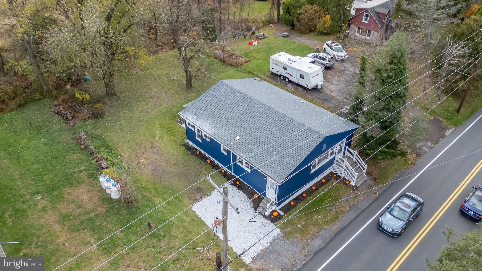 an aerial view of a house with outdoor space