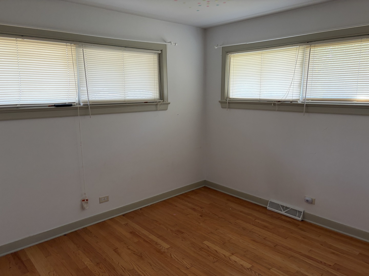 3969 Maple Avenue Northbrook, IL 60062 - Photo 5 of 7 an empty room with wooden floor and windows