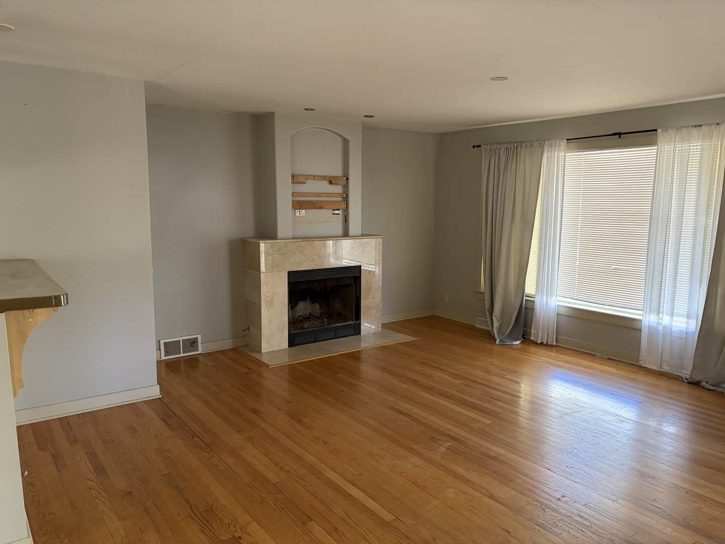 3969 Maple Avenue Northbrook, IL 60062 - Photo 6 of 7 a view of empty room with wooden floor and fireplace
