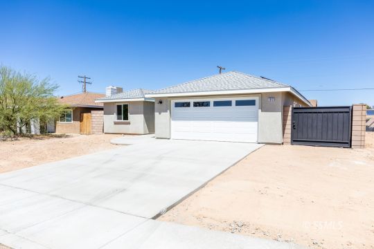1012 Sims Street Ridgecrest, CA 93555 - Photo 3 of 36 a front view of a house with a outdoor space