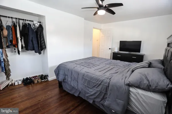 a bedroom with a bed and a walk in closet
