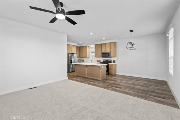 a kitchen with stainless steel appliances a refrigerator and a sink