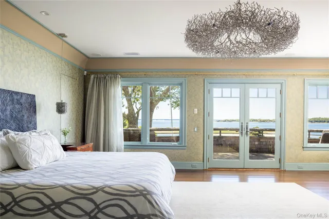 a bedroom with a bed next to a window with outer view