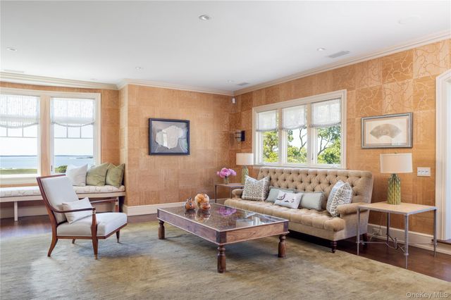 an aerial view of a house with a garden and mountain view
