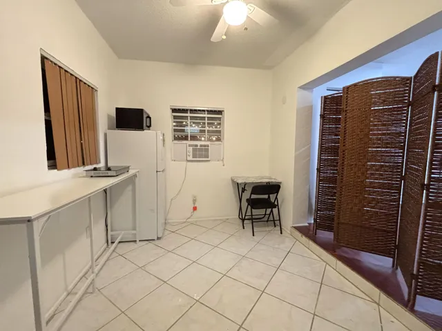 a view of room with furniture and window