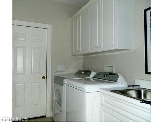 2314 Addison Boulevard High Point, NC 27262 - Photo 14 of 16 Laundry Room. Laundry room has cabinetry and utility sink