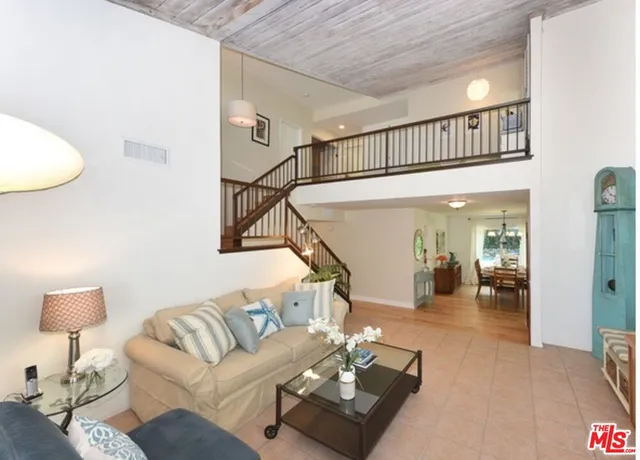 a living room with fireplace furniture and a flat screen tv