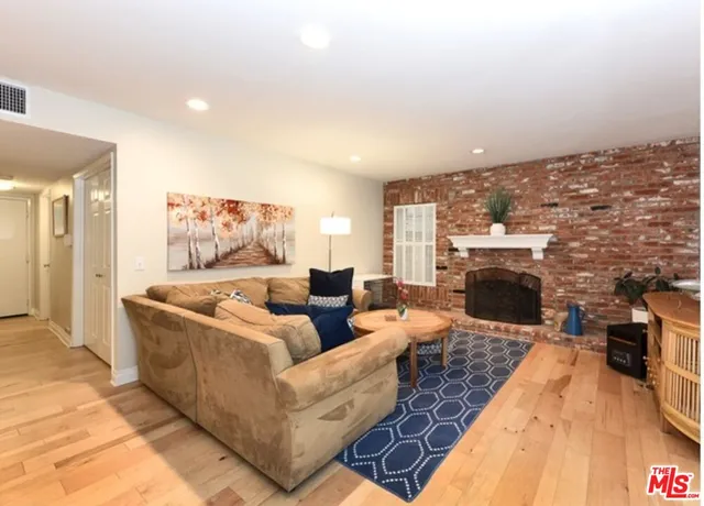 a kitchen with stainless steel appliances a refrigerator sink and cabinets