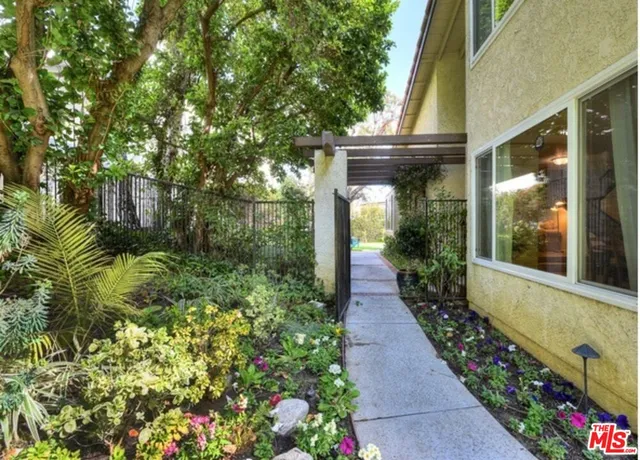 a balcony with wooden floor and fence