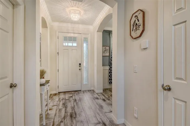 a living room with furniture and kitchen view