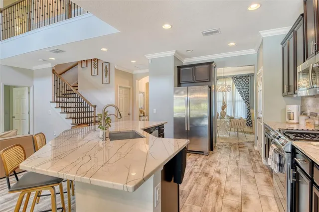 a bathroom with a granite countertop bathtub and shower
