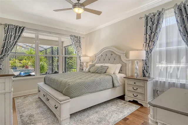 a bedroom with a bed and a painting on the wall