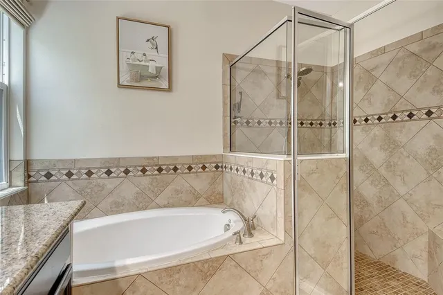 a bathroom with a sink a toilet and shower curtain