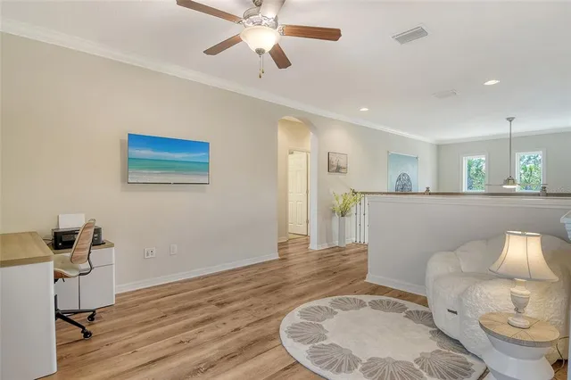 a view of a chair and table in backyard with a small yard