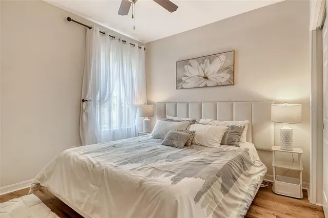 a view of a swimming pool with lawn chairs and a fire pit