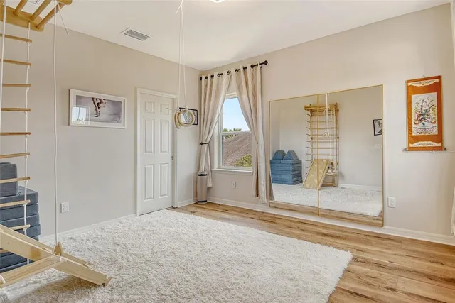 a view of a lake with boats and trees in the background