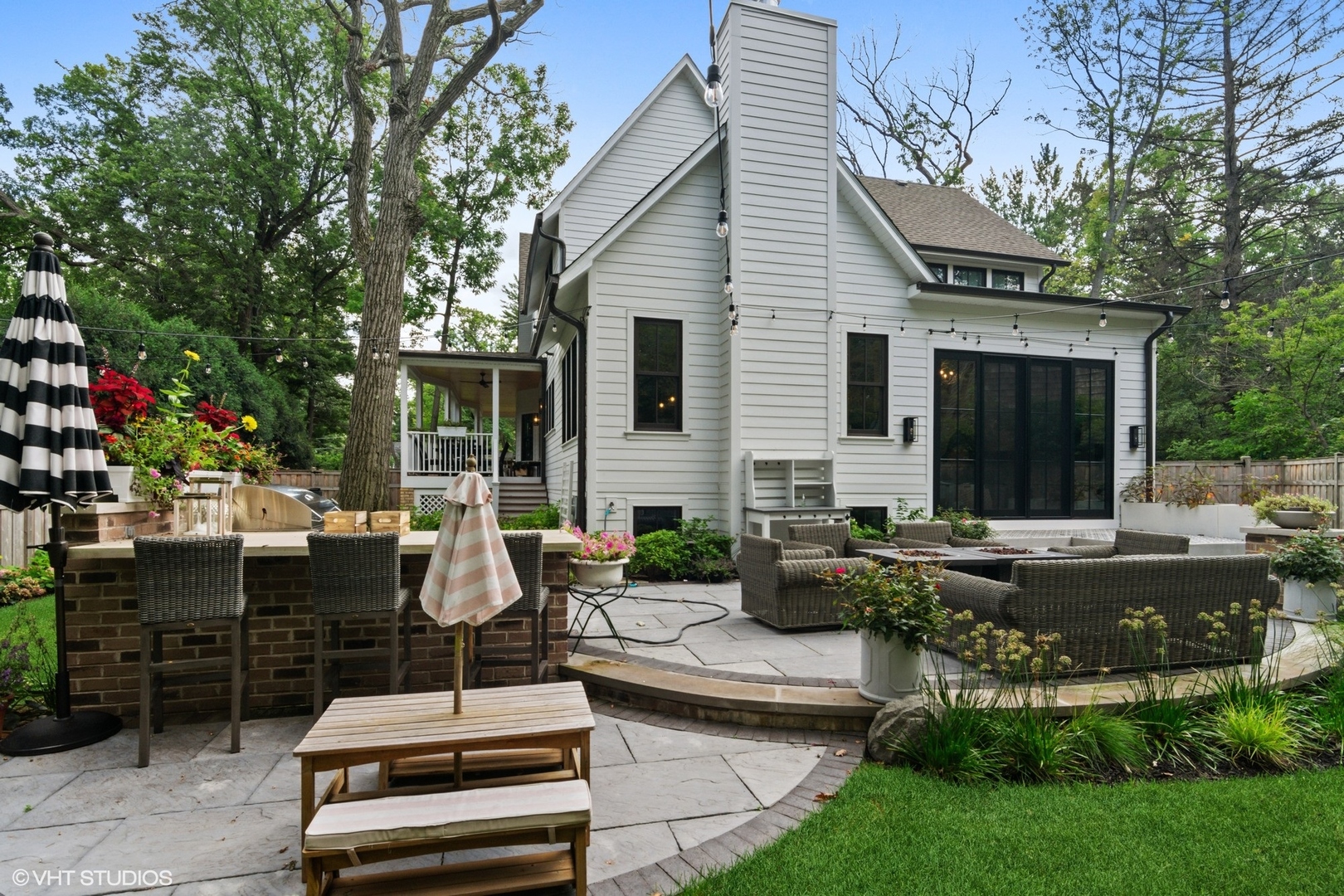735 Baldwin Road Highland Park, IL 60035 - Photo 24 of 30 a view of a house with backyard sitting area and garden