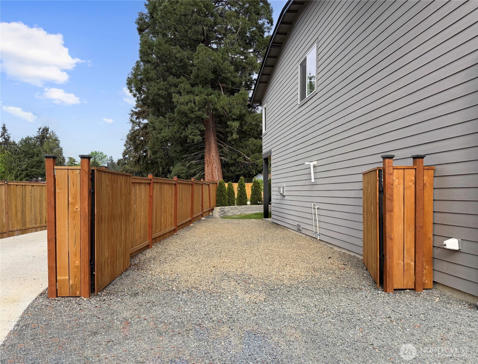 719 Edmonds Way Edmonds, WA 98020 - Photo 35 of 40 a view of a house with backyard and trees
