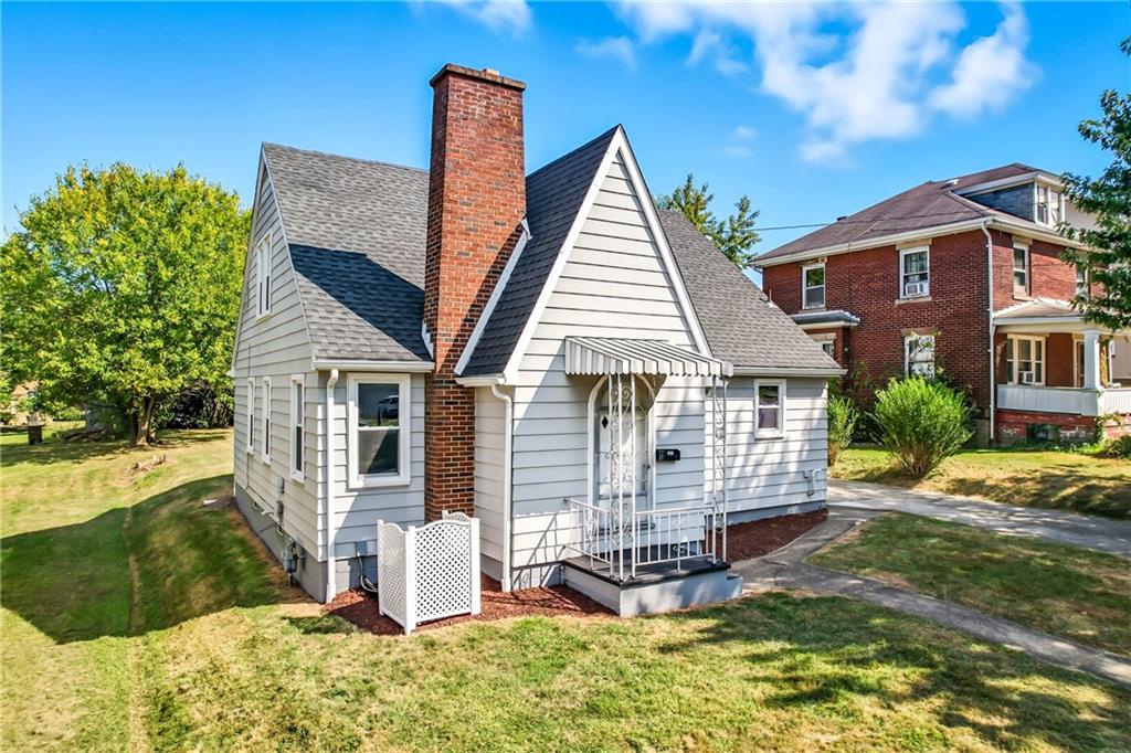 front view of a house with a yard