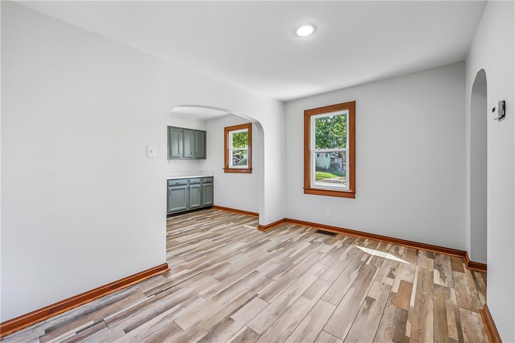 609 Park Avenue Farrell, PA 16121 - Photo 13 of 49 wooden floor in an empty room with a window