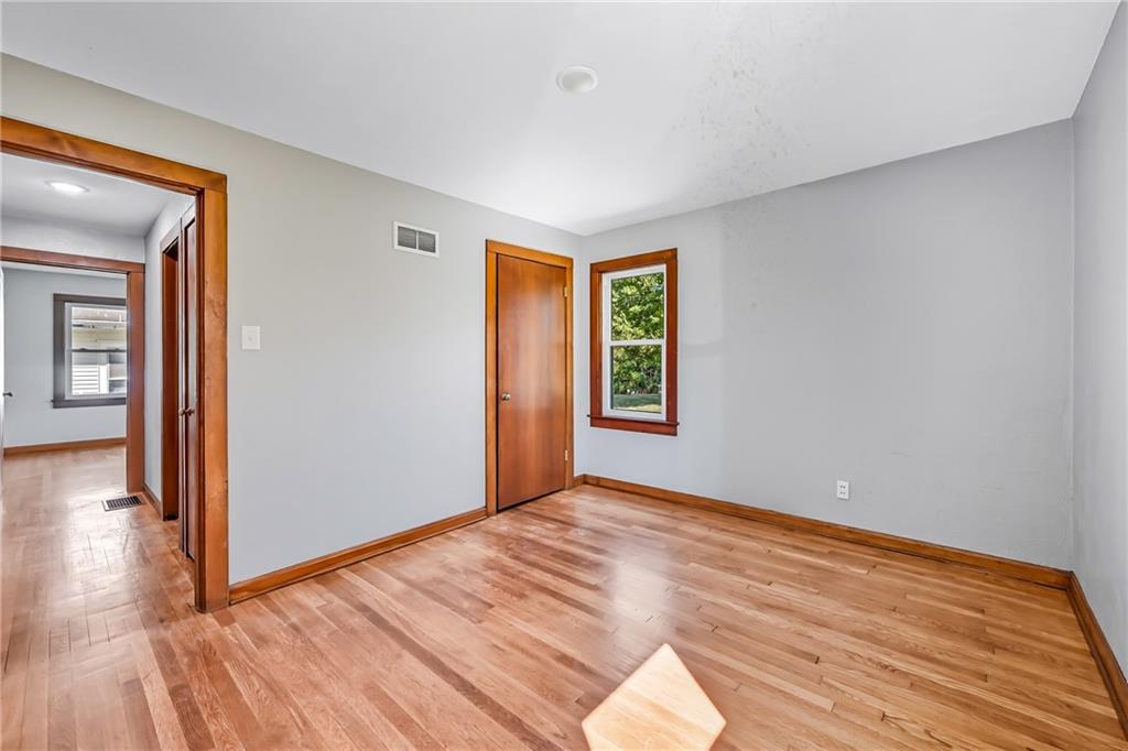 609 Park Avenue Farrell, PA 16121 - Photo 21 of 49 a view of empty room with wooden floor and fan