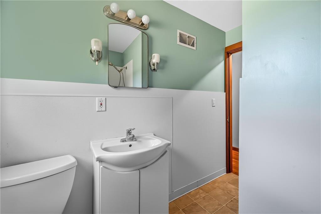 609 Park Avenue Farrell, PA 16121 - Photo 25 of 49 a bathroom with a sink and mirror