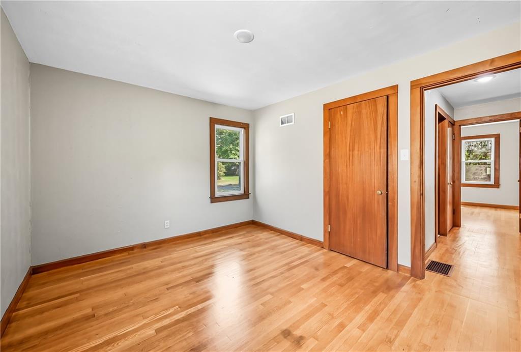 609 Park Avenue Farrell, PA 16121 - Photo 26 of 49 a view of an empty room with window and wooden floor