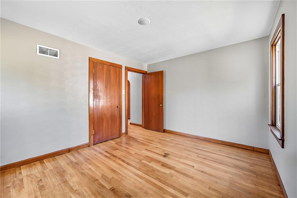 609 Park Avenue Farrell, PA 16121 - Photo 28 of 49 a view of empty room with wooden floor and fan